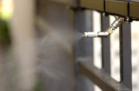 A pyretherum-insecticide misting nozzles installed on a fence for a mosquito-free yard